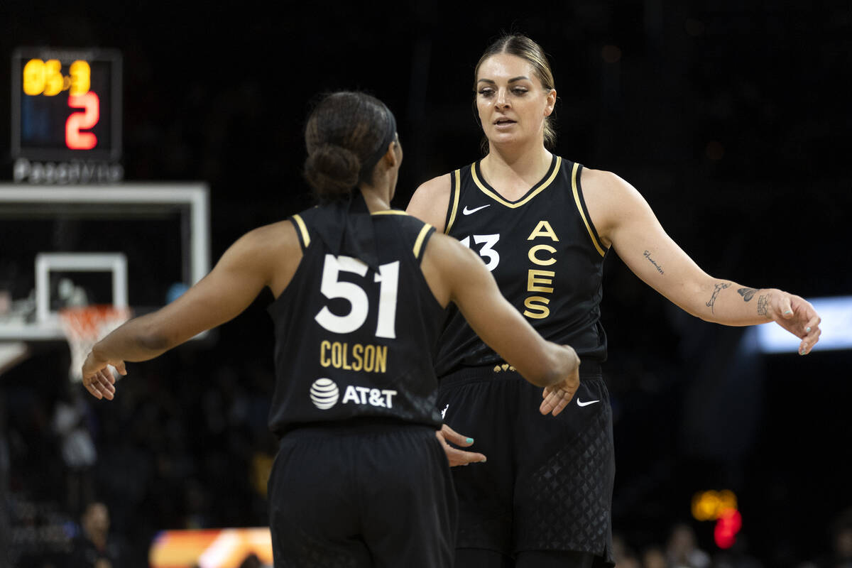 Las Vegas Aces forward Cayla George (13) and guard Sydney Colson (51) congratulate each other o ...