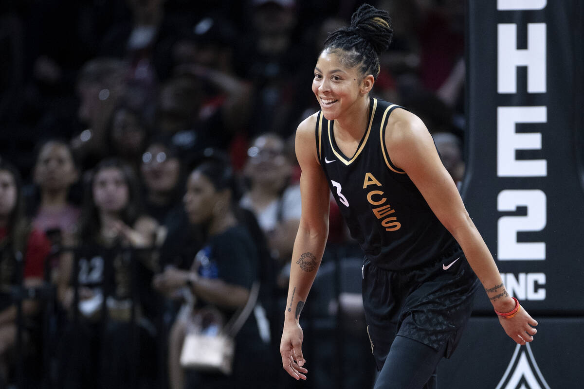 Las Vegas Aces forward Candace Parker (3) laughs after rebounding a Seattle Storm shot during t ...