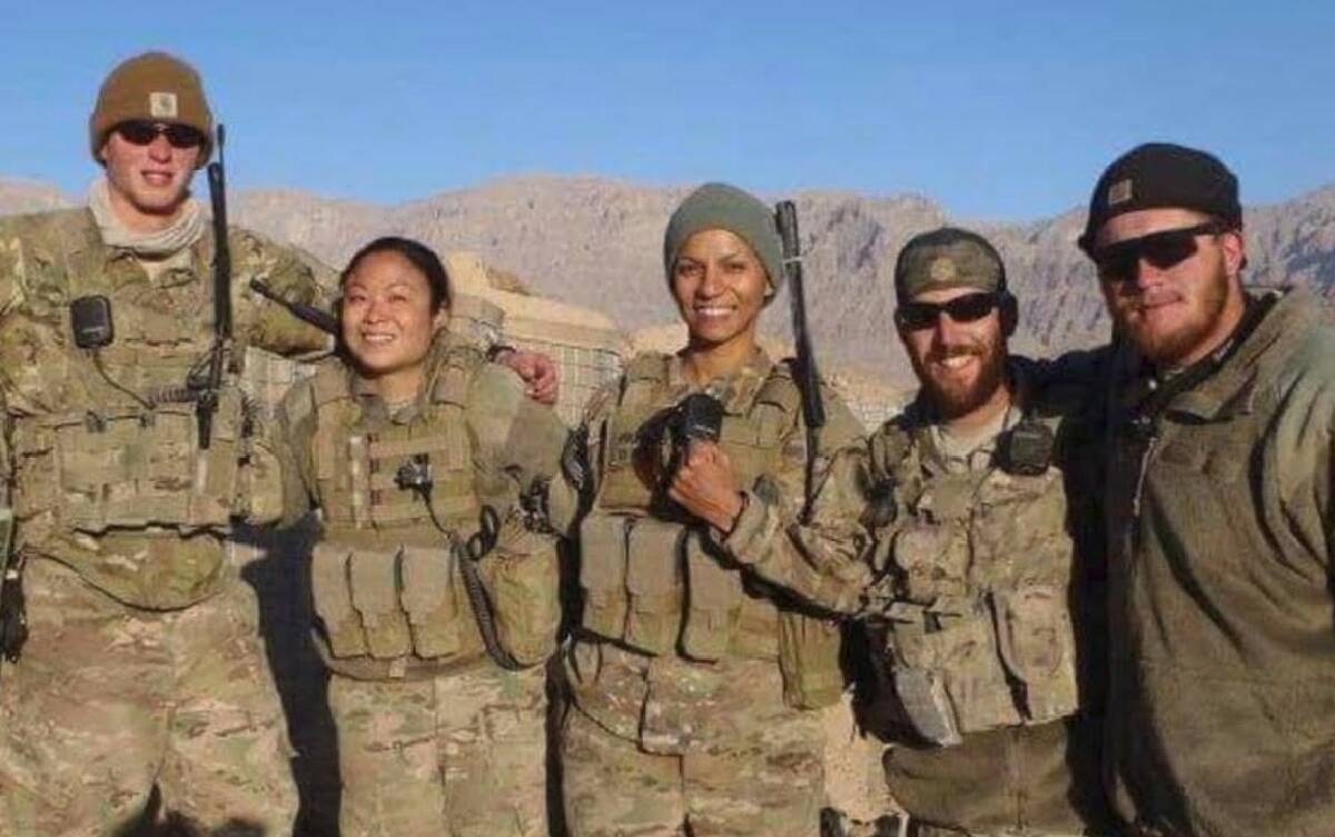 Shirley Wu is pictured next to her Cultural Support Team partner, Raquel Patrick, alongside a m ...