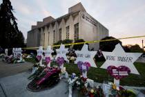 A makeshift memorial stands outside the Tree of Life Synagogue in the aftermath of a deadly sho ...