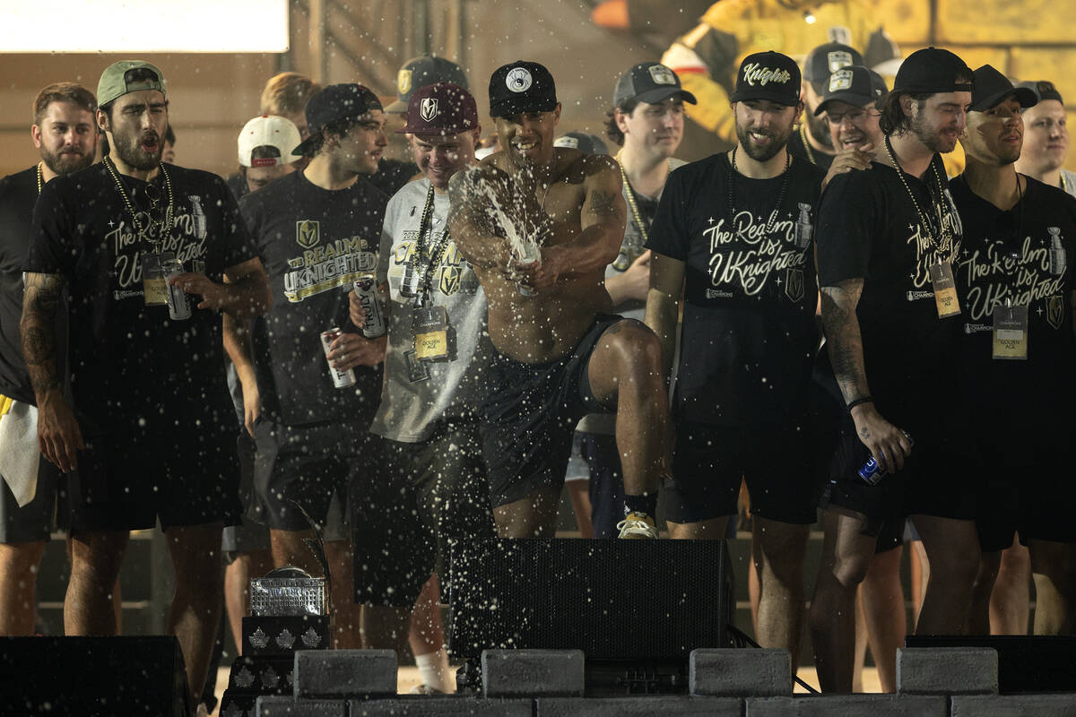 Golden Knights right wing Keegan Kolesar (55) sprays champagne on the crowd during Knights Stan ...