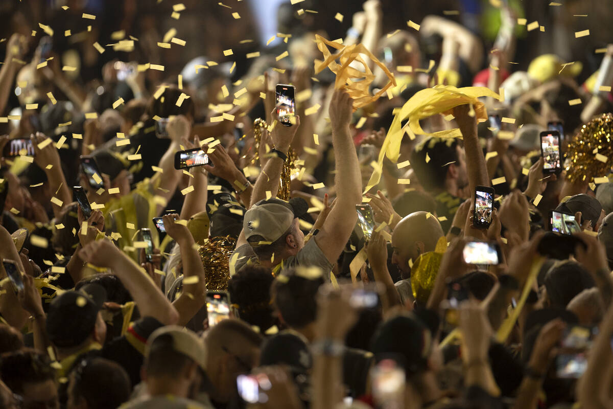 Confetti showers Golden Knights fans as they gather to celebrate the team’s Stanley Cup ...