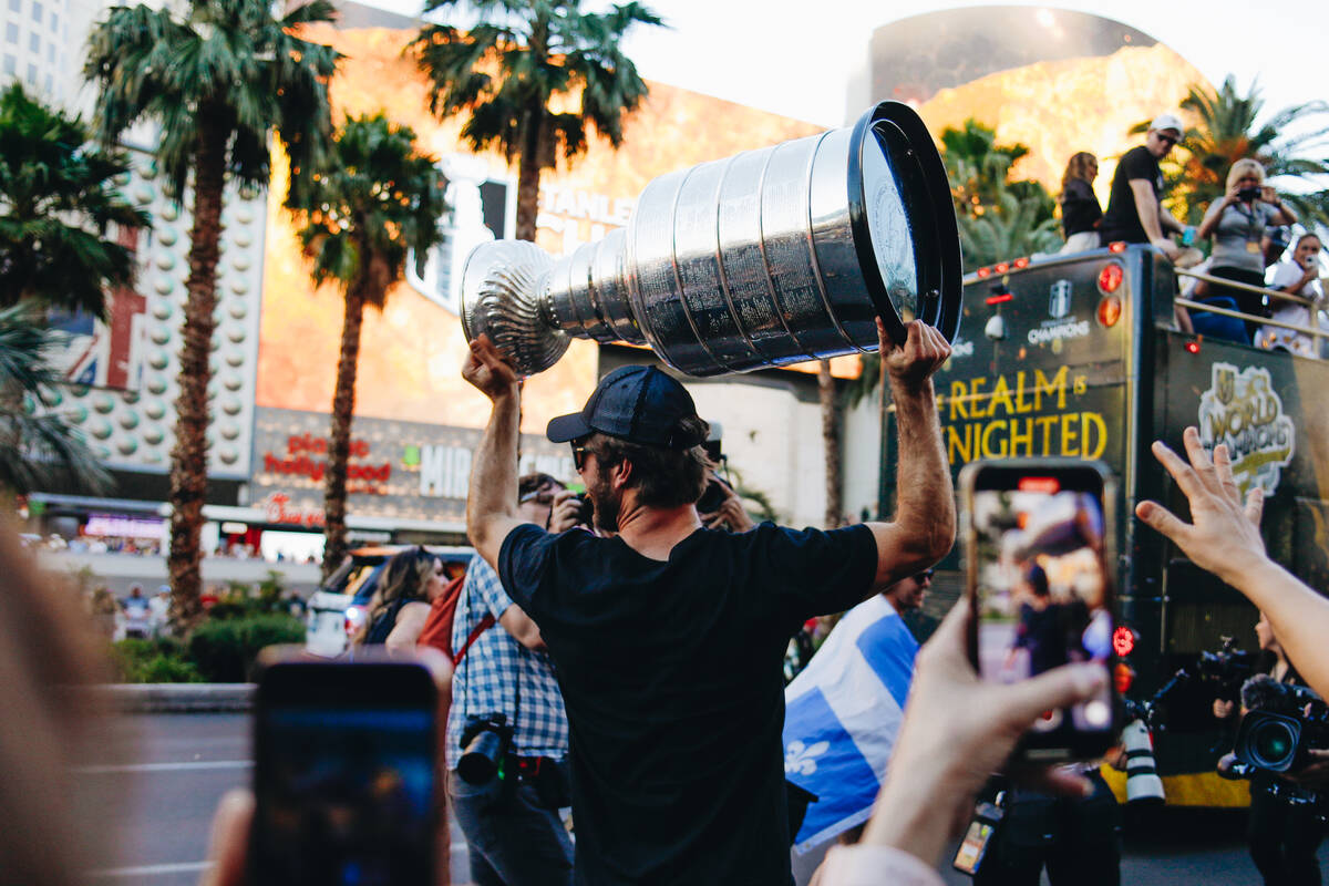 The Stanley Cup is carried down the Strip during the Stanley Cup championship parade on Saturda ...