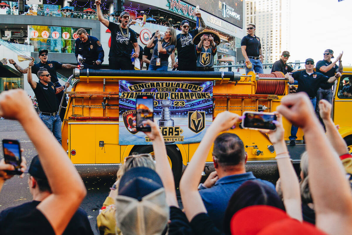 Buses full of Golden Knights players make their way down the strip during the Stanley Cup champ ...