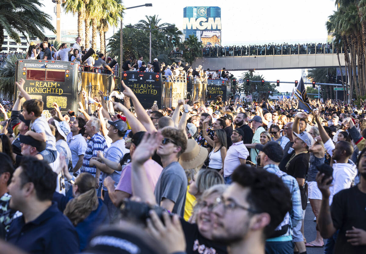 Golden Knights fans and players celebrate during a parade to mark their team's Stanley Cup win, ...