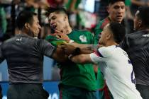 Sergino Dest of the United States pushes Gerardo Arteaga of Mexico during the second half of a ...