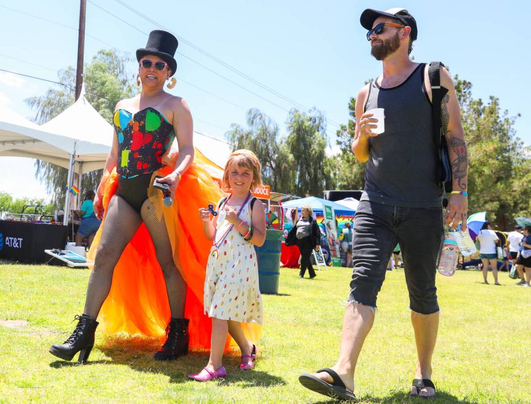 Sania Dela Cruz, left, Sunny Marshall and Joseph Marshall explore the 3rd annual LGBTQ Henderso ...