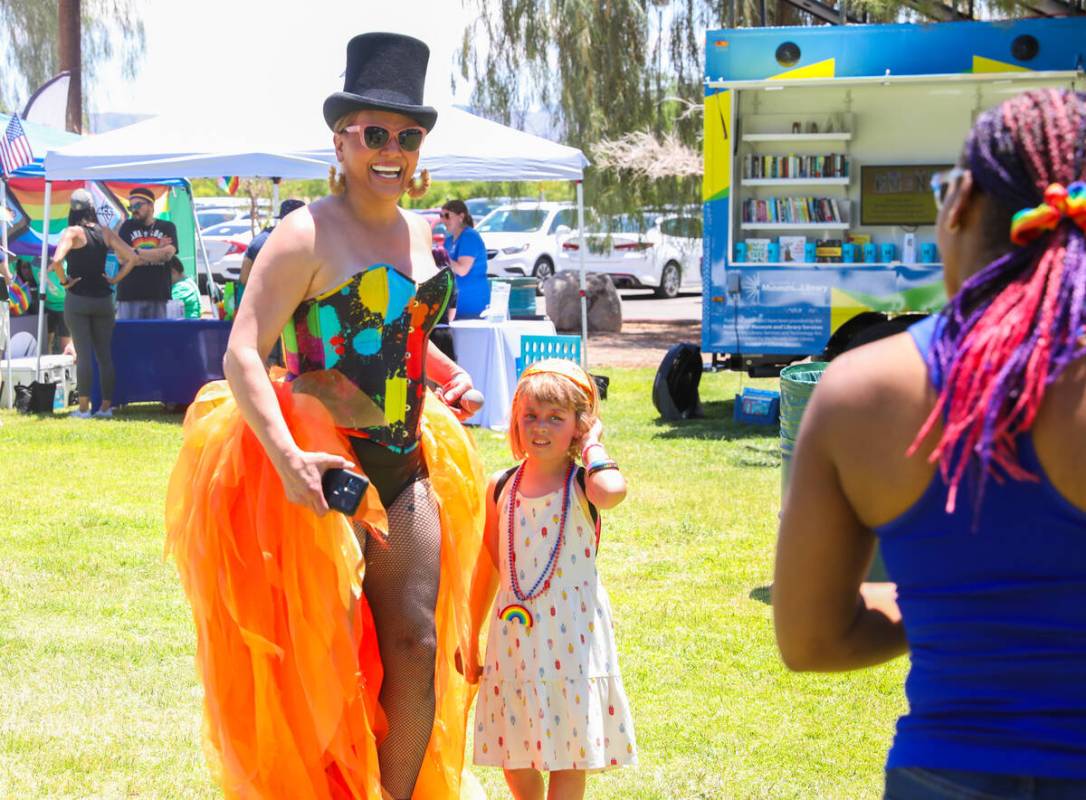Sania Dela Cruz, left, gets ready to take a picture with Sunny Marshall at the 3rd annual LGBTQ ...