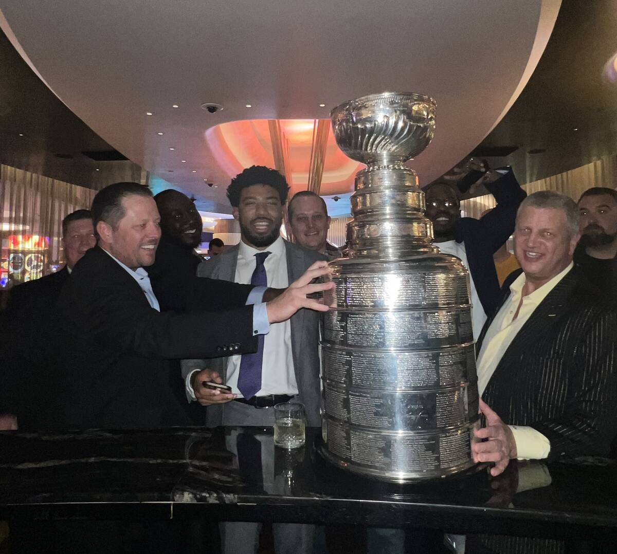 Derek Stevens and Circa casino hosts are shown with the Stanley Cup at Circa on Saturday, June ...