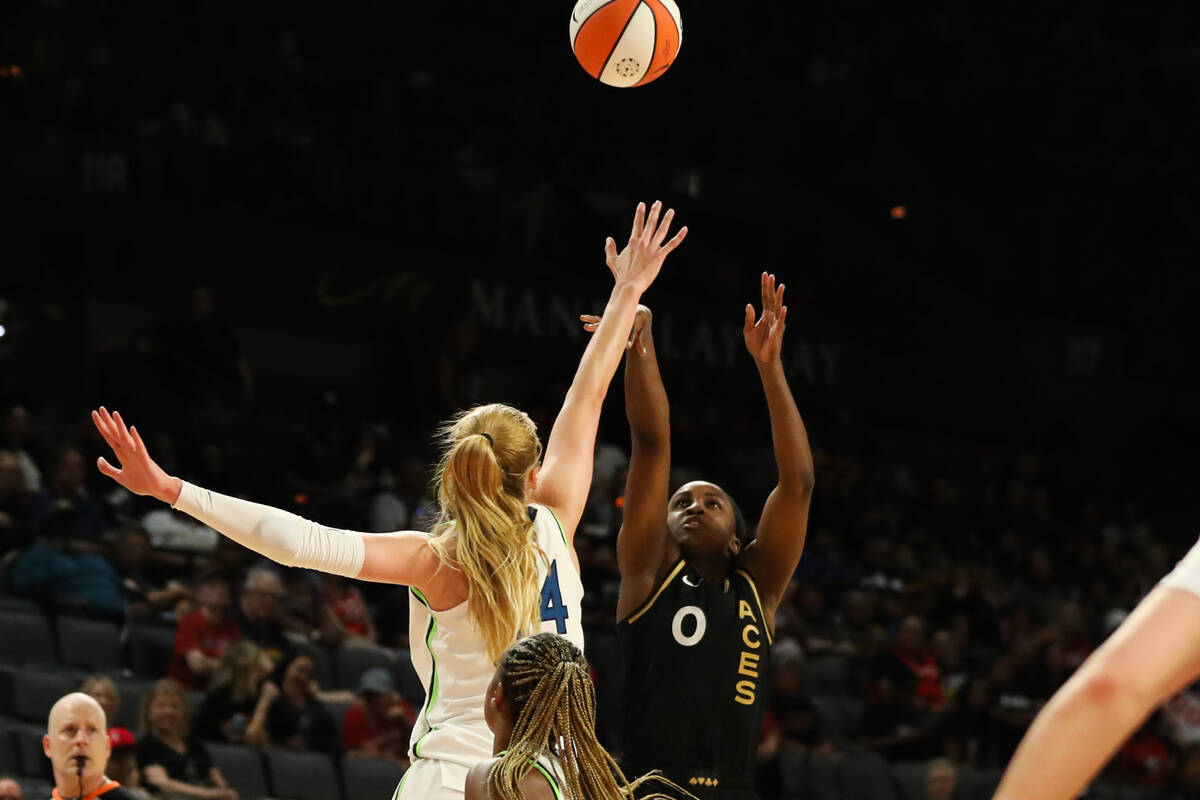 Las Vegas Aces guard Jackie Young (0) takes a shot during a game against the Minnesota Lynx on ...