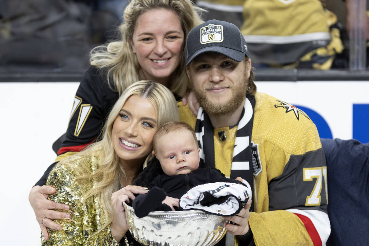 Golden Knights center William Karlsson (71) poses with his family, wife Emily Ferguson, bottom ...