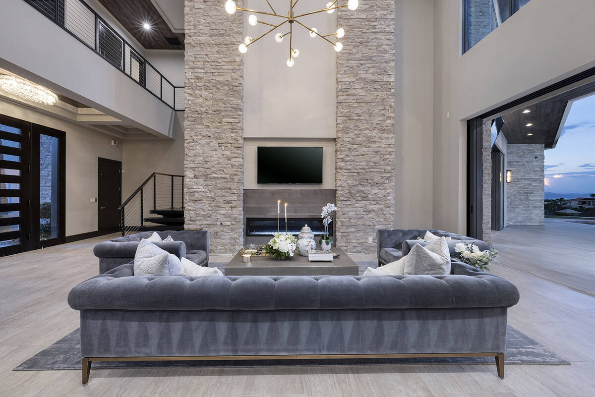 The living room features a modern fireplace. (Douglas Elliman of Nevada)