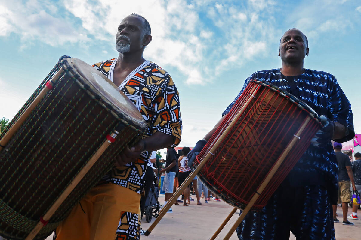 Hasani Palacio, left, and Sam Wright prepare to go on stage with the Olabisi African Drum and D ...