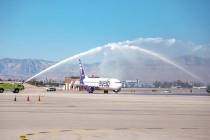 An Avelo Airlines jet receives the traditional water cannon salute after making its first trip ...