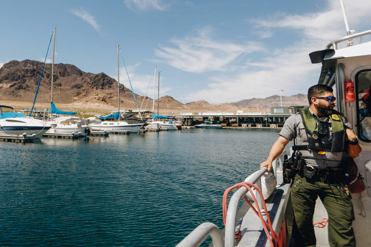 Ranger Alberto Flores stands off to the side of a National Park Service boat on Wednesday, May ...