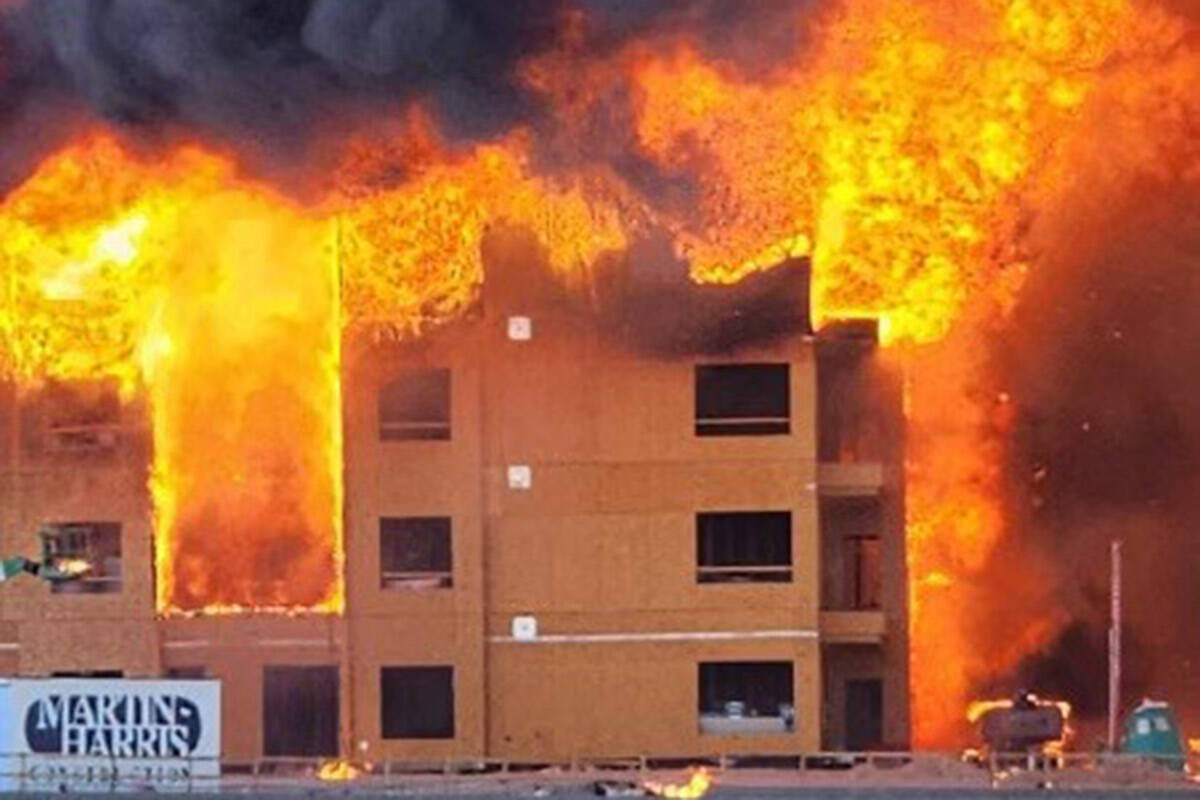 An under-construction residential complex burns near Buffalo Drive and the 215 Beltway on Tuesd ...