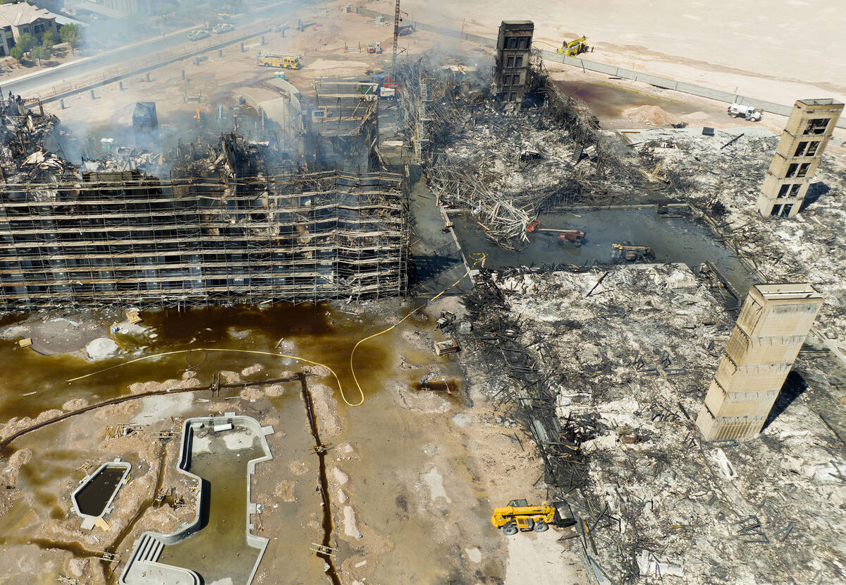 Aerial view of damage caused by a massive fire in an apartment complex under construction near ...