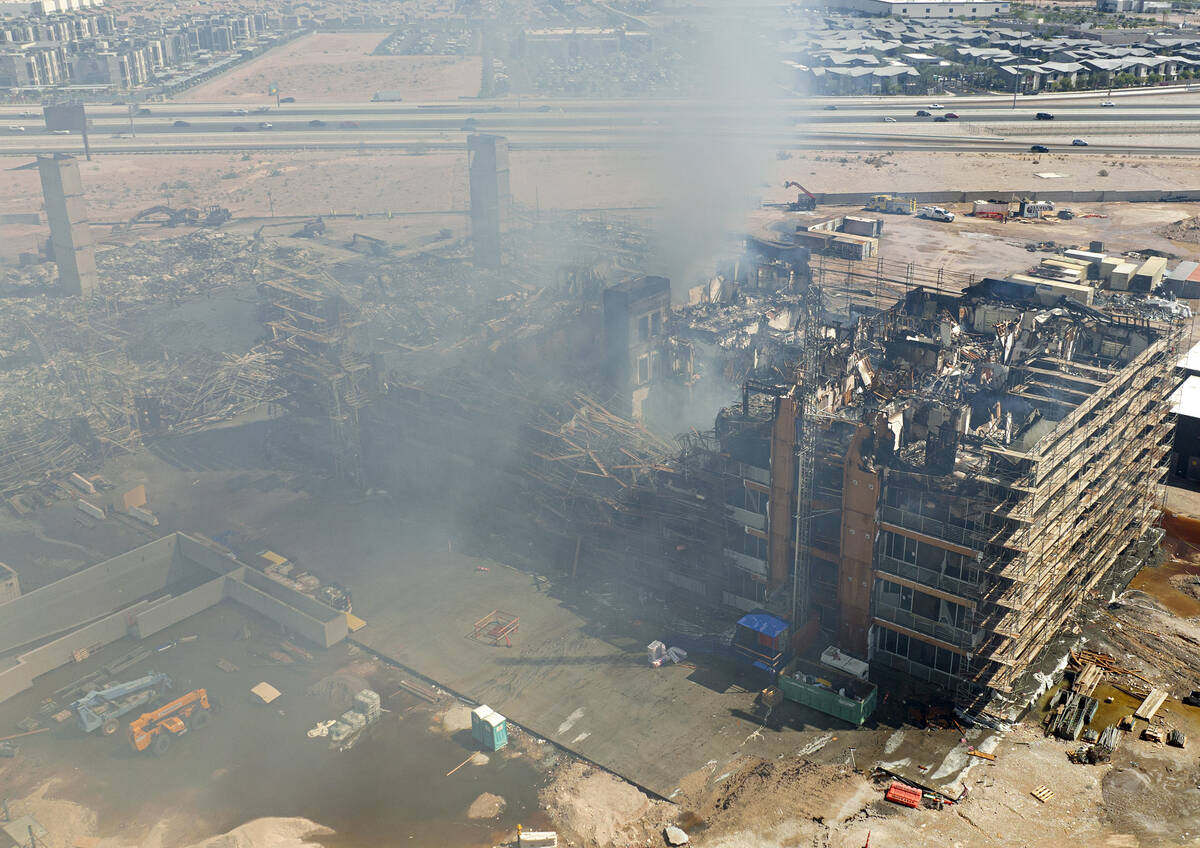 Aerial view of damage caused by a massive fire in an apartment complex under construction near ...