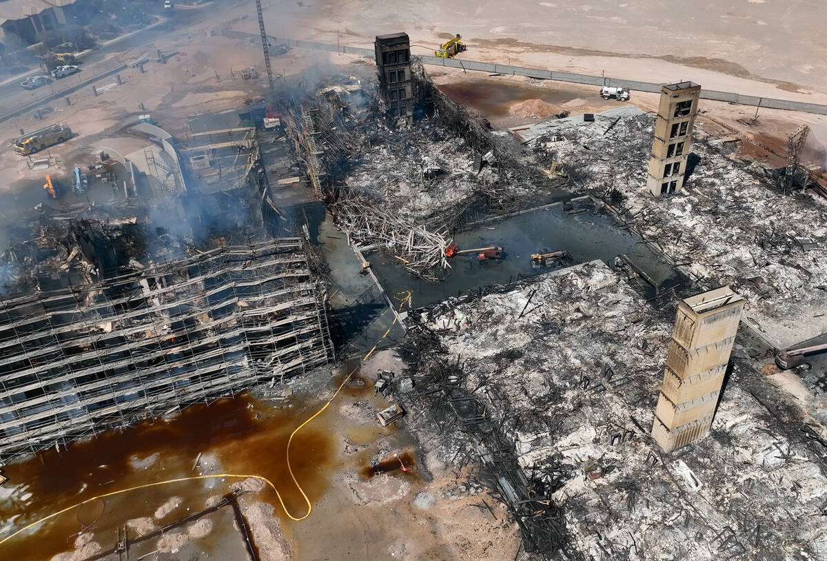 Aerial view of damage caused by a massive fire in an apartment complex under construction near ...