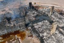 Aerial view of damage caused by a massive fire in an apartment complex under construction near ...