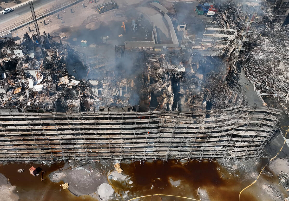 Aerial view of damage caused by a massive fire in an apartment complex under construction near ...