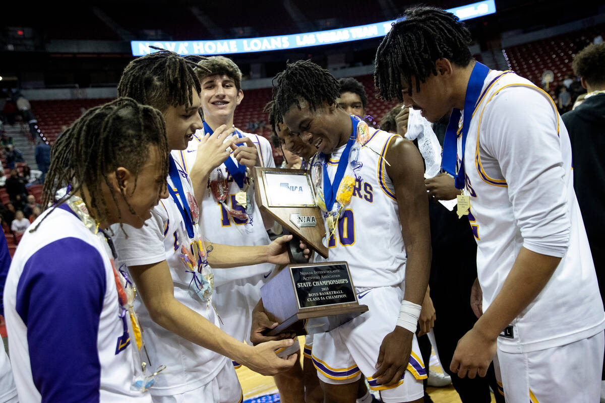 Durango’s Tylen Riley admires the NIAA Class 5A boys high school basketball state champi ...