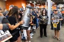 Golden Knights fans wait in line to get their Stanley Cup merchandise signed by Golden Knoights ...