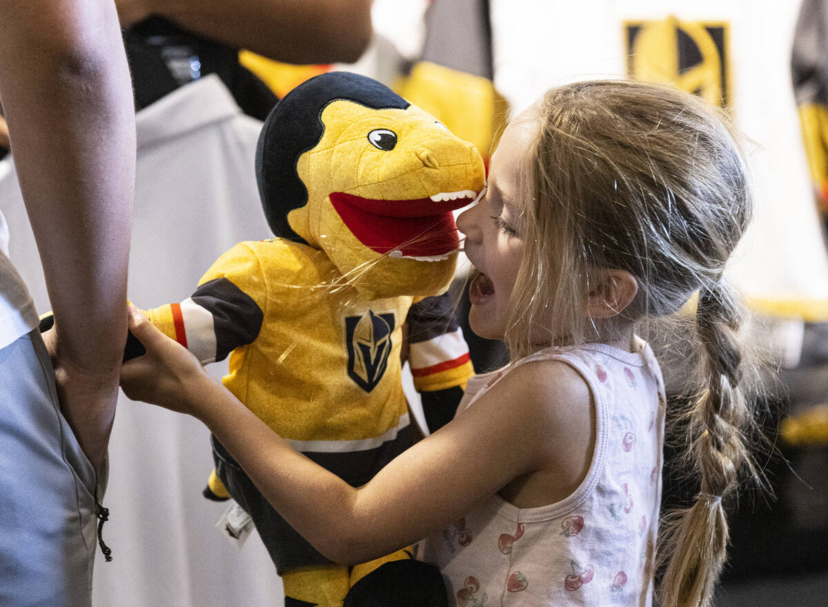 Macey Lebaron, 4, plays with Golden Knights stuffed mascot Chance at The Arsenal at City Nation ...