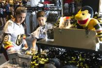 Christina F. and her son Daniel, 9, shop Stanley Cup championship merchandise at The Arsenal at ...