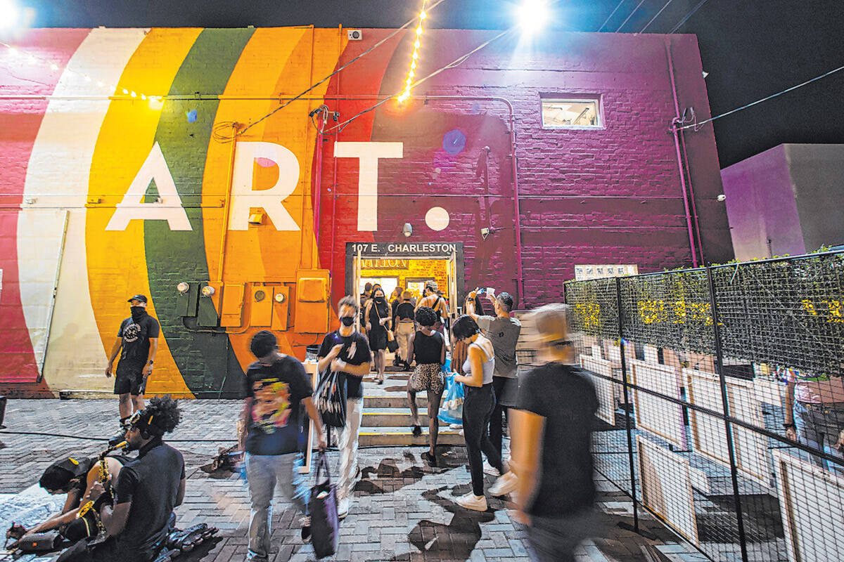 Visitors enter and exit The Arts Factory during First Friday in the Arts District of downtown L ...