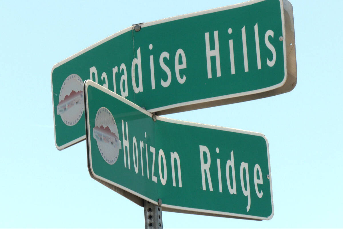Signs mark the intersection of Paradise Hills Drive and Horizon Ridge Parkway on Thursday, June ...