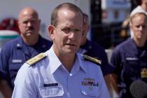 U.S. Coast Guard Rear Adm. John Mauger, commander of the First Coast Guard District, talks to t ...