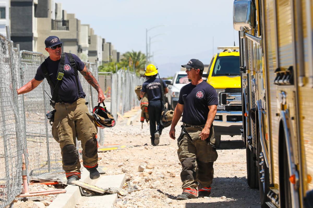 Firefighters work on a fire in an apartment complex under construction at 8030 W. Maule Ave on ...
