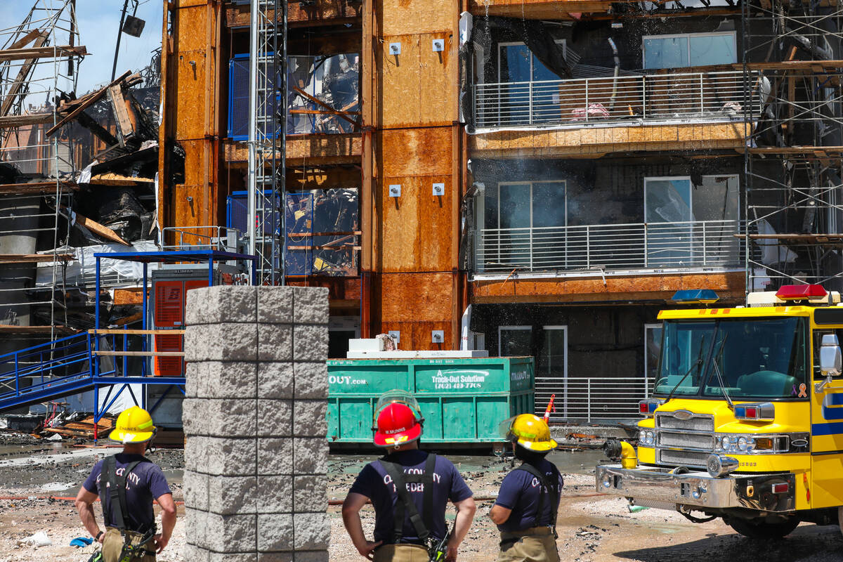 Firefighters work on a fire in an apartment complex under construction at 8030 W. Maule Ave on ...