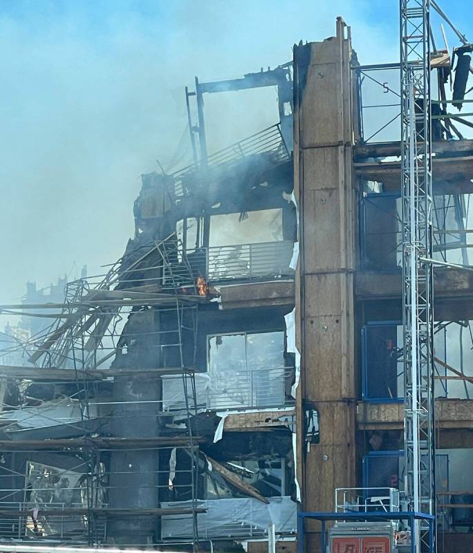 Smoke billows on Thursday, June 22, 2023, from an apartment complex under construction at 8030 ...