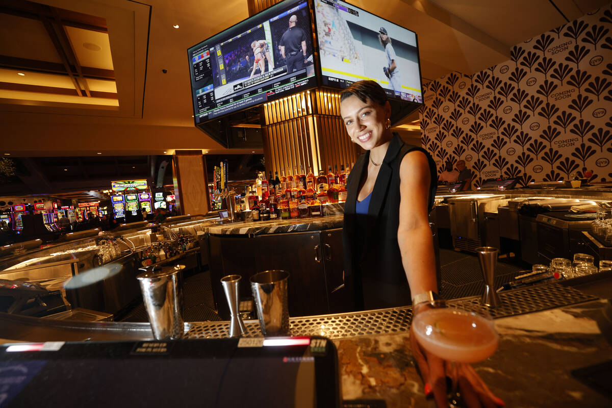 Jamie Clark, corporate mixologist, poses with a drink at the Polaris Bar, Thursday, June 22, 20 ...