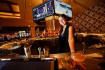 Jamie Clark, corporate mixologist, poses with a drink at the Polaris Bar, Thursday, June 22, 20 ...