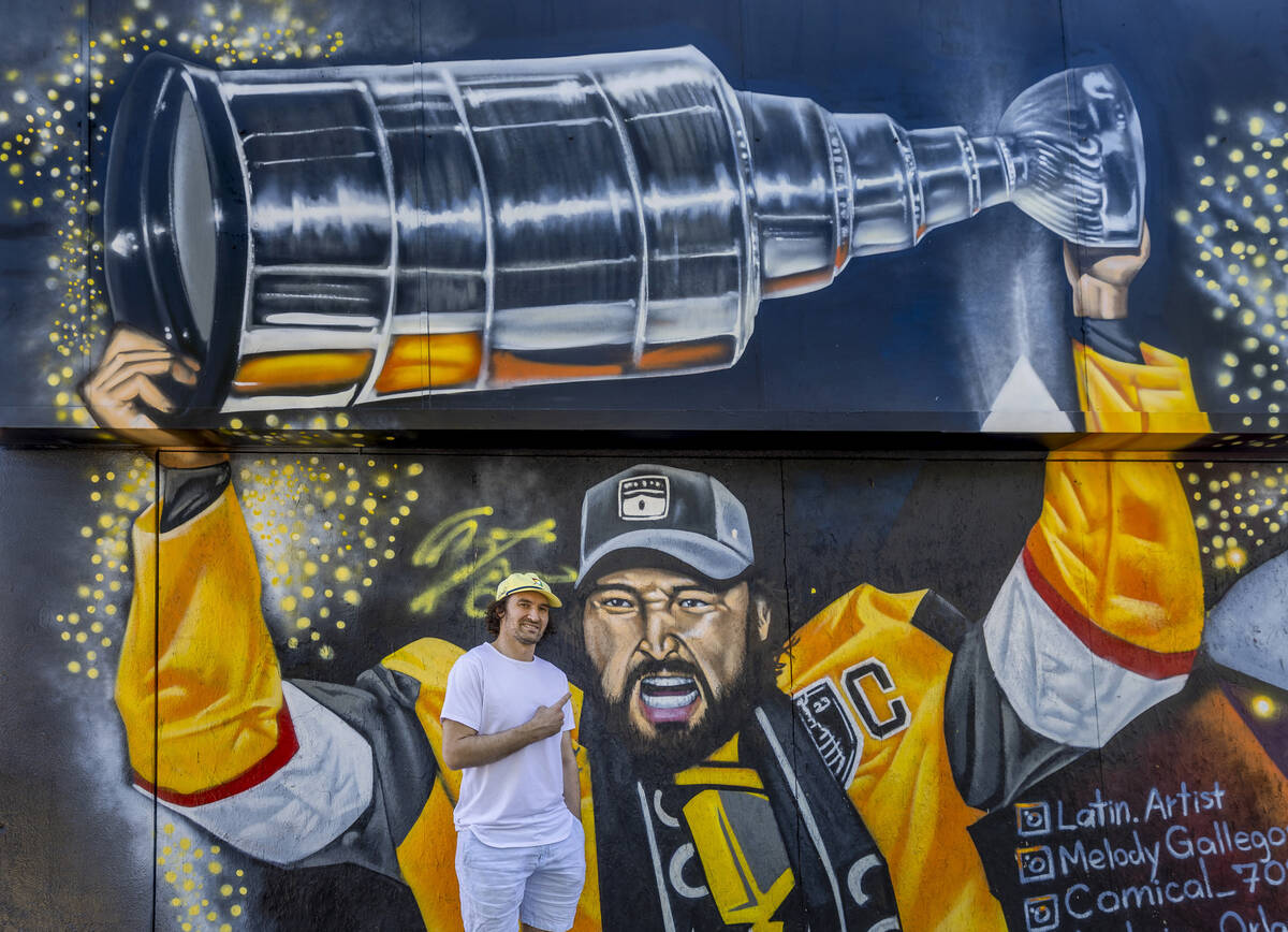 Golden Knights Mark Stone at a new mural of him holding the Stanley Cup painted by artists in t ...