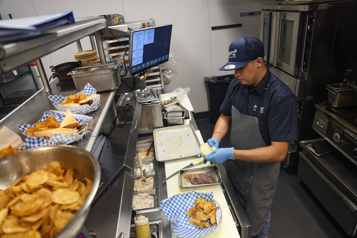 Jose Aleman cooks in the kitchen at Saginaw’s Deli at Circa hotel-casino in Las Vegas, T ...