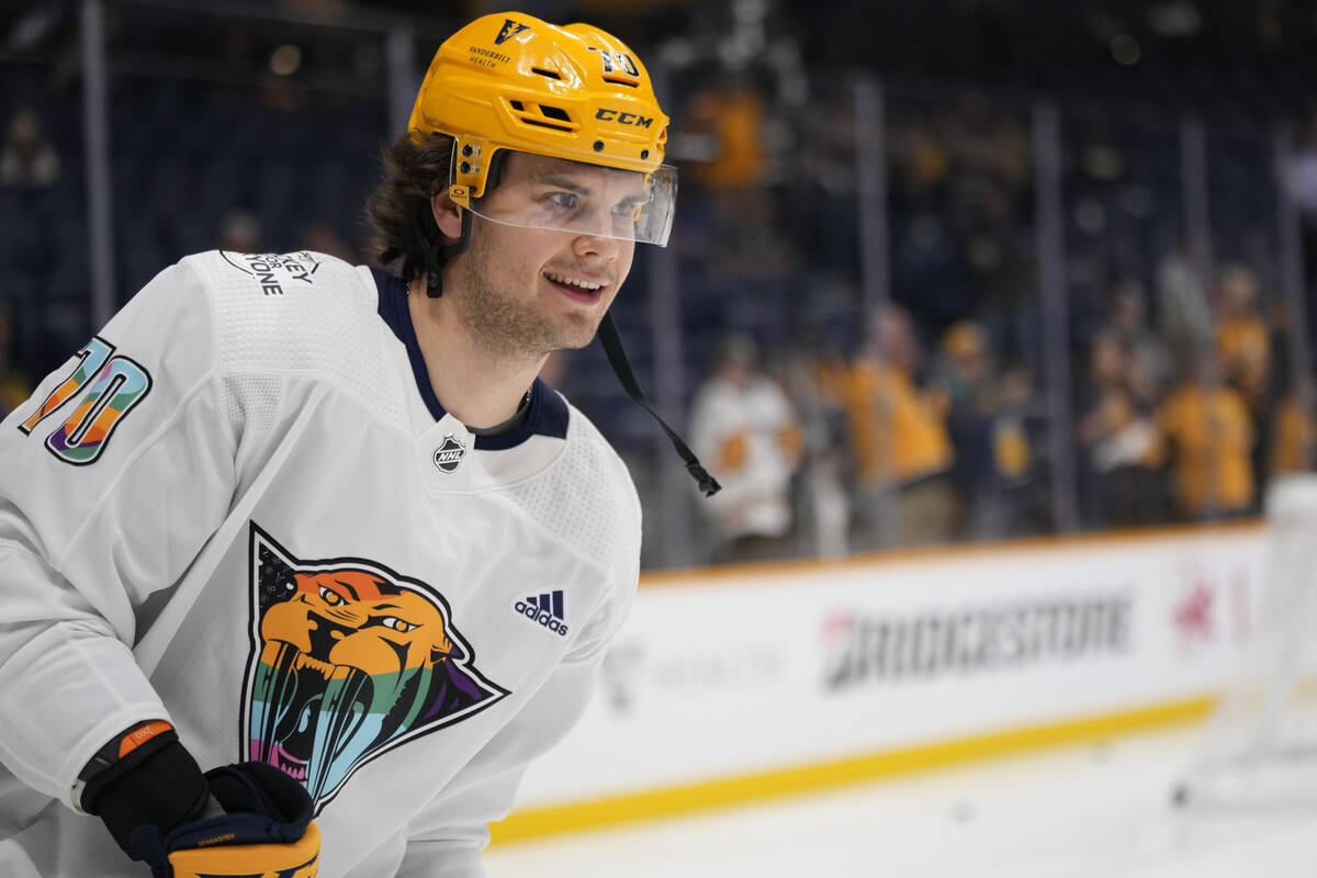 Nashville Predators left wing Egor Afanasyev wears a Pride Night jersey while warming up for th ...