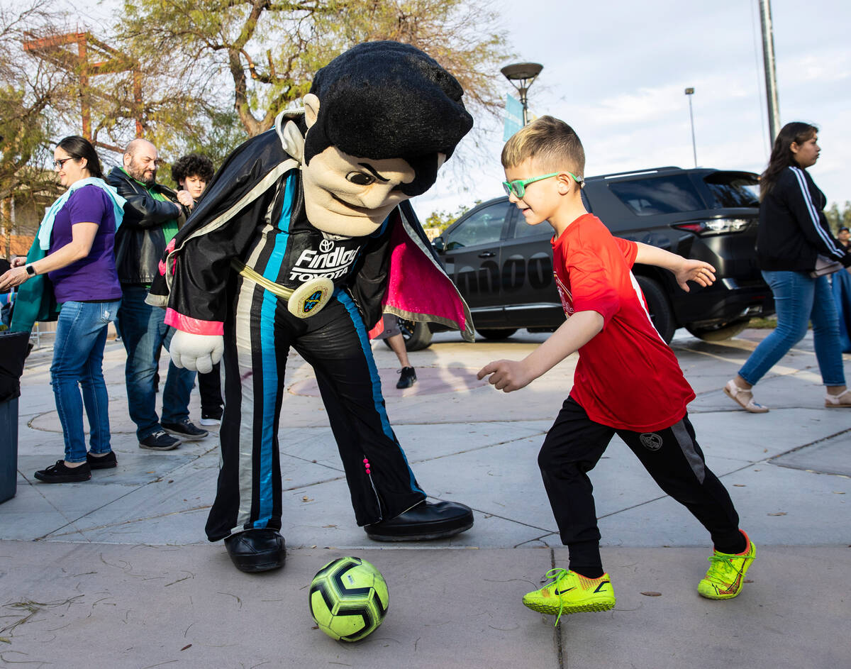 Emil Maslesa, 6, plays Soccer with the Las Vegas Lights FC mascot “Cash the Soccer Rocke ...