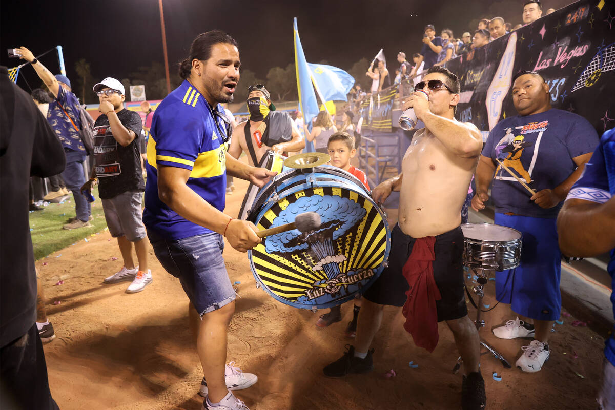Fans cheer behind the goal near the end of an USL Championship soccer game between the Las Vega ...
