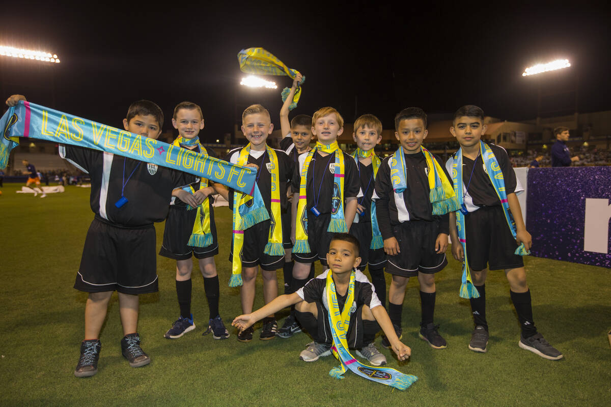 A youth soccer team gets a chance to get onto the field at a Las Vegas Lights FC game against S ...