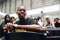 Ayden Dozier, 12, watches a group of children from Broadway in the Hood perform on Thursday, Ju ...