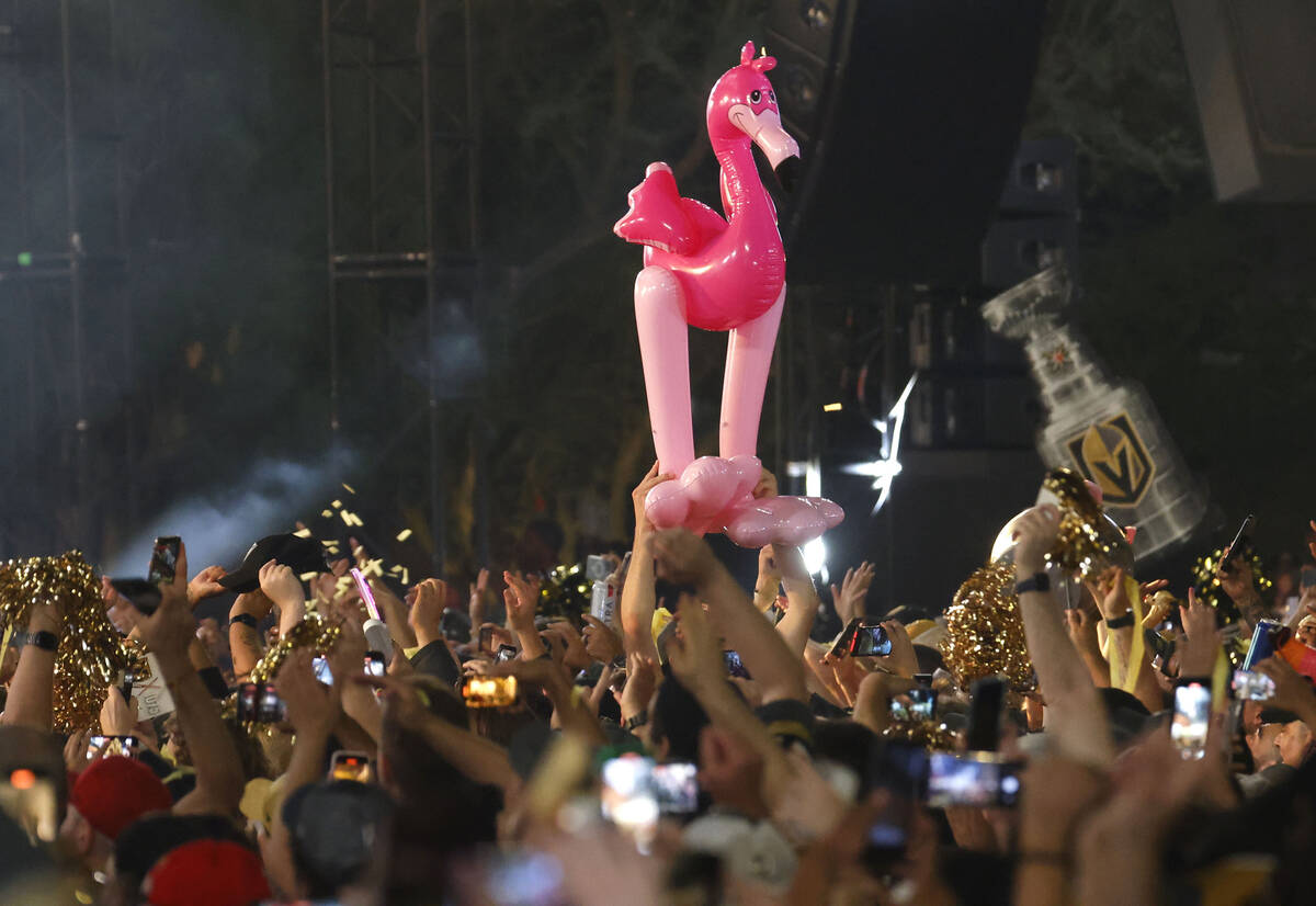 People celebrate during a rally at Toshiba Plaza after the Golden Knights’ NHL hockey St ...