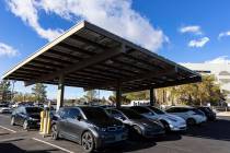 Electric vehicles get their battery recharged in the parking lot of NV Energy's headquarters at ...