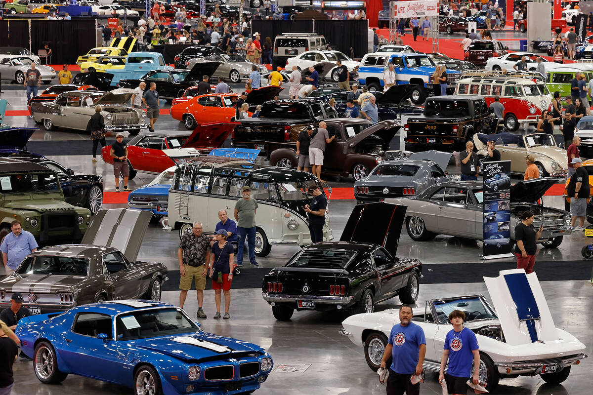 People walk around during the Barrett-Jackson Auction at the Las Vegas Convention Center, Frida ...