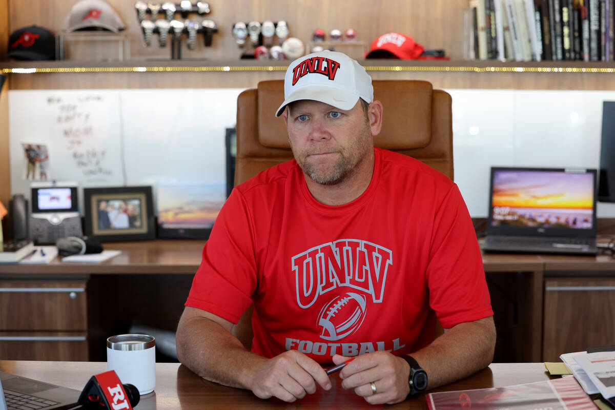 UNLV football coach Barry Odom talks to a reporter at his office in the Fertitta Football Compl ...