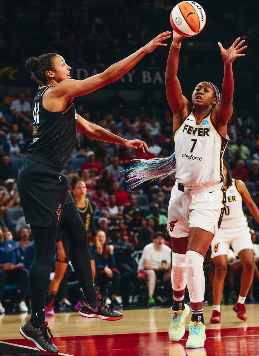Las Vegas Aces center Kiah Stokes (41) reaches for the ball as Indiana Fever forward/center Ali ...