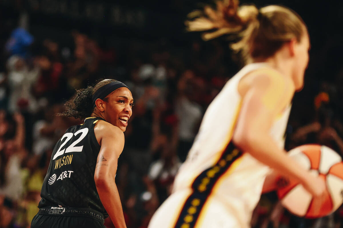 Las Vegas Aces center A’ja Wilson (22) celebrates making a bucket as she runs across the ...